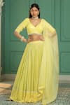 Buy_Monk & Mei_Yellow Georgette Woven Geometric V Neck Lehenga Set _at_Aza_Fashions