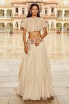 Buy_Nikita Vishakha_Ivory Blouse Net Hand Embroidery Pearl Cape Round Floral Flare Lehenga Set _at_Aza_Fashions