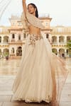 Buy_Nikita Vishakha_Ivory Blouse Net Hand Embroidery Pearl Cape Round Floral Flare Lehenga Set _Online_at_Aza_Fashions