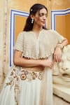 Nikita Vishakha_Ivory Blouse Net Hand Embroidery Pearl Cape Round Floral Flare Lehenga Set _at_Aza_Fashions