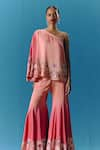 Buy_Pooja Rajgarhia Gupta_Peach Silk Satin Hand Embroidered Twilight Asymmetric Top With Bell Bottom Pant _at_Aza_Fashions