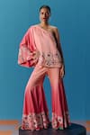 Buy_Pooja Rajgarhia Gupta_Peach Silk Satin Hand Embroidered Twilight Asymmetric Top With Bell Bottom Pant _Online_at_Aza_Fashions