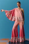 Shop_Pooja Rajgarhia Gupta_Peach Silk Satin Hand Embroidered Twilight Asymmetric Top With Bell Bottom Pant _Online_at_Aza_Fashions