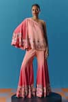 Pooja Rajgarhia Gupta_Peach Silk Satin Hand Embroidered Twilight Asymmetric Top With Bell Bottom Pant _at_Aza_Fashions