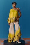 Buy_Pooja Rajgarhia Gupta_Yellow Silk Satin Hand Embroidered Sunlit Asymmetric Top With Bell Bottom Pant _at_Aza_Fashions