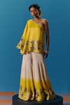 Buy_Pooja Rajgarhia Gupta_Yellow Silk Satin Hand Embroidered Sunlit Asymmetric Top With Bell Bottom Pant _Online_at_Aza_Fashions