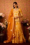 Buy_Shyam Narayan Prasad_Gold Viscose Silk Brocade Applique Floral Round Neck Bloom Tunic And Lehenga Set _at_Aza_Fashions