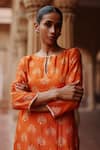 Shop_Megha Pitti_Orange Dupion Silk Print Lotus Sequin Boat Motif Embellished Kurta With Pant _Online_at_Aza_Fashions