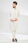 Buy_Kasbah_Ivory Silk Embroidered Cutdana Long Jacket _at_Aza_Fashions