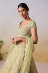 Mirroir_Green Metallic Tissue Embroidered Embellished Floral Scatter Bridal Lehenga Set _at_Aza_Fashions