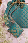 Shop_SWABHIMANN_Blue Woven Crest Bloom Potli Bag _at_Aza_Fashions