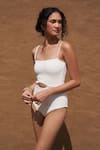 Shop Nirvanaa_White Recycled Italian Fabric High Eza Cut-out Front Monokini _Online_at_Aza_Fashions