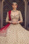 Shop_Nitika Gujral_Gold Tissue Embroidery Dori Sweetheart Neck Stone Bridal Lehenga Set _Online_at_Aza_Fashions