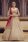 Buy_Nitika Gujral_Gold Tissue Embroidery Dori Sweetheart Neck Stone Bridal Lehenga Set _at_Aza_Fashions