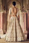 Shop_Nitika Gujral_Gold Raw Silk Embroidered Dori Scallop 3d Sequin Embellished Bridal Lehenga Set _at_Aza_Fashions