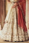 Nitika Gujral_Gold Raw Silk Embroidered Dori Scallop 3d Sequin Embellished Bridal Lehenga Set _Online_at_Aza_Fashions