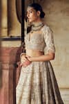 Nitika Gujral_Gold Raw Silk Embroidered Dori 3d Sequin Scallop Embellished Bridal Lehenga Set _Online_at_Aza_Fashions