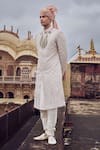 Buy_Nitika Gujral_White Raw Silk Embroidered Gold Zari Sherwani Set _at_Aza_Fashions