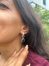 Buy_Prata_Green Stones, Zari Glintwave Spark Earrings _at_Aza_Fashions