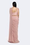 Shop Onaya Pink Lycra Cut Work, Sequins Leaf Embellished Hem Pre-draped Saree With Blouse at Aza Fashions Shop_Onaya_Pink Lycra Cut Work, Sequins Leaf Embellished Hem Pre-draped Saree With Blouse _at_Aza_Fashions