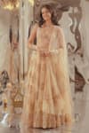 Buy_TUHINA SRIVASTAVA_Beige Silk Velvet Embroidered Stone Scoop Leaf Pattern Lehenga Blouse Set _at_Aza_Fashions