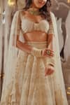 Buy_TUHINA SRIVASTAVA_Off White Silk Velvet Embroidered Glass Bead Sweetheart Lehenga Blouse Set _Online_at_Aza_Fashions