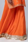 Pants and Pajamas_Orange Embroidery Floral Round Neck Flower Kurta Sharara Set _at_Aza_Fashions