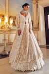 Buy_Seema Gujral_Ivory Net Embroidery Pearl Sweetheart Neck Longline Jacket Lehenga Set _at_Aza_Fashions