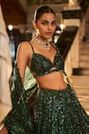 Shop_Seema Gujral_Emerald Green Net Embroidery Sequin Sweetheart Neck Stripe Bridal Lehenga Set _at_Aza_Fashions