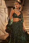 Seema Gujral_Emerald Green Net Embroidery Sequin Sweetheart Neck Stripe Bridal Lehenga Set _at_Aza_Fashions