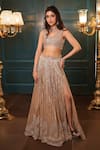 Isa By Dolly Wahal_Gold Net Embellished Bead Sweetheart Jasmine Crystal Slit Bridal Lehenga Set _Online_at_Aza_Fashions