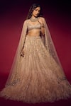 Buy_Isa By Dolly Wahal_Gold Net Embellished Bead Scoop Sequin Feather Bridal Lehenga Set _at_Aza_Fashions