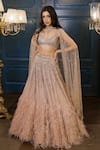 Shop_Isa By Dolly Wahal_Gold Net Embellished Bead Scoop Sequin Feather Bridal Lehenga Set _at_Aza_Fashions