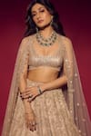 Shop_Isa By Dolly Wahal_Gold Net Embellished Bead Scoop Sequin Feather Bridal Lehenga Set 