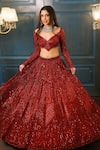 Shop_Isa By Dolly Wahal_Maroon Net Embellished Bead Sweetheart Rida Sequin Chevron Lehenga Set _Online_at_Aza_Fashions