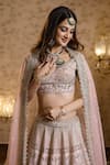 Shop_Isa By Dolly Wahal_Pink Net Embellished Pearl Zardozi Embroidered Floral Bridal Lehenga Set _Online_at_Aza_Fashions