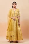 Buy_Nitya Bajaj_Yellow Woven Floral Flower Lehenga Set _at_Aza_Fashions