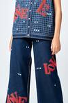 Shahin Mannan Blue Denim Embroidery, Beads Love Flared Pant at Aza Fashions Shahin Mannan_Blue Denim Embroidery, Beads Love Flared Pant _at_Aza_Fashions