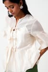 Madder Much_Ivory Handloom Chanderi Woven Round Toni Peplum Top With Inner _Online_at_Aza_Fashions