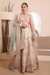 Buy_ISHRAM COUTURE_Ivory Handwoven Cotton Silk Embroidered Thread V-neck Moksh Floral Lehenga Set _at_Aza_Fashions