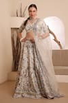 Buy_ISHRAM COUTURE_Ivory Handwoven Cotton Silk Embroidered Thread Tamanna Floral Lehenga Set _at_Aza_Fashions