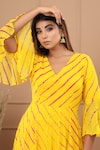 SUTI KAPDA_Yellow Chiffon V Neck Leheriya Pattern Flared Gown _at_Aza_Fashions