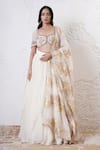 Shop_Shwetanga_Ivory Organza Foil Printed Sequin Sweetheart Ruffle Layered Lehenga Set _Online_at_Aza_Fashions