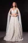 Buy_RAJ ARORA_Ivory Net Embroidered Sequins In Different Shapes V-neck Majesty Lehenga Set _at_Aza_Fashions