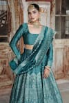 Safaa_Blue Vegan Silk Woven Floral Buttis Square Mirea Peacock Lehenga Set _at_Aza_Fashions