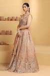 Shop_MeenaGurnam_Beige Tissue Embroidery Nakshi Paan Neck Rosette Cutwork Pattern Lehenga Set _Online_at_Aza_Fashions