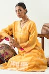 Shivani Bhargava_Yellow Silk Stripe Tissue Handwoven Zari V-neck Mira Choga Kurta _at_Aza_Fashions