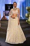 Awigna_Ivory Net Embroidery Crystal Blunt V Neck Belgium Daisy Lehenga Set _at_Aza_Fashions