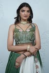 Zardozi Zari_Green Raw Silk Embroidery Zardozi Sweetheart Neck Tulip Bloom Lehenga Set _at_Aza_Fashions