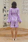 Shop_Khajoor Studio_Purple 100% Cotton V Neck Hakuna Matata Printed Short Jumpsuit _at_Aza_Fashions